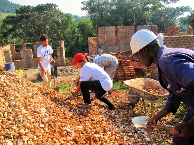 Students members of Duke Engineers for International Development (DEID) work on new school buildings in Uganda in 2015