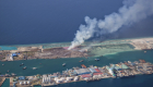 Aerial view of Thilafushi island with a trash burning plume visible 