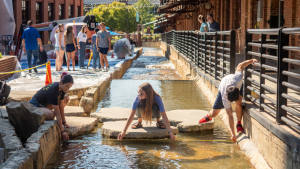 Duke students measure water flows in downtown Durham, NC USA