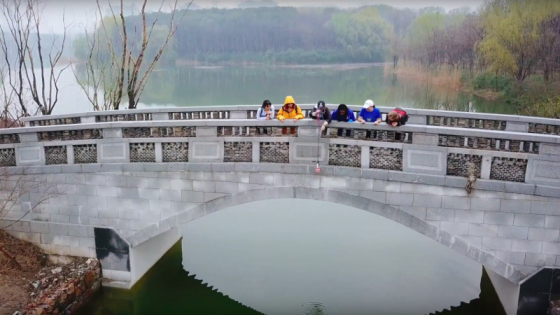still from Kunshan video of students on bridge 