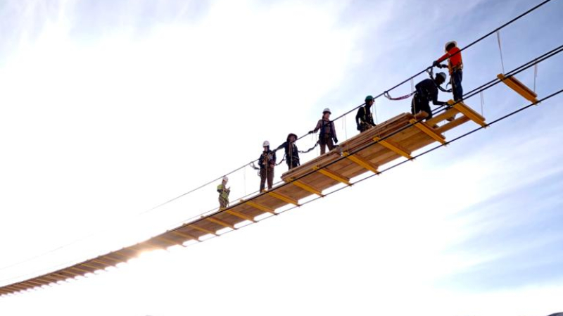 Duke University students construct a footbridge in Japo, Bolivia in 2022