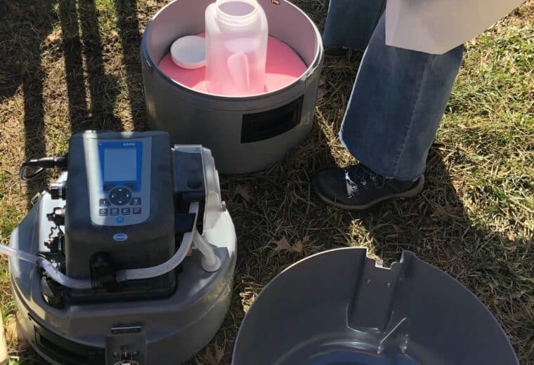 WaSH-AID team member Molly Matlock conducting wastewater sampling
