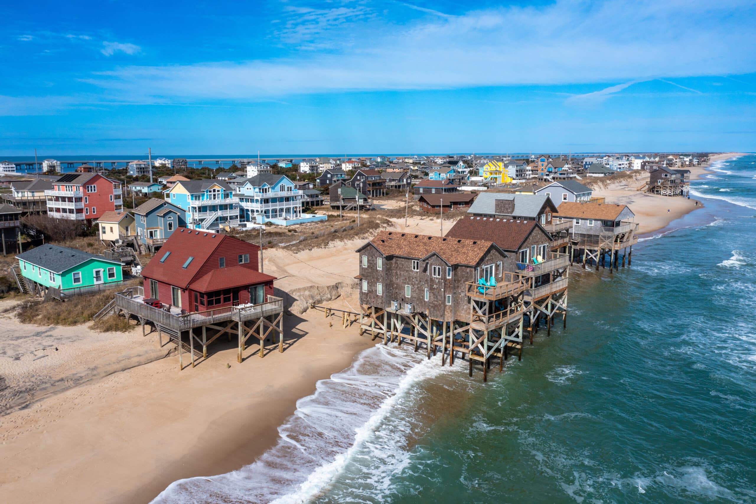 beach homes in the ocean at high tide in North Carolina